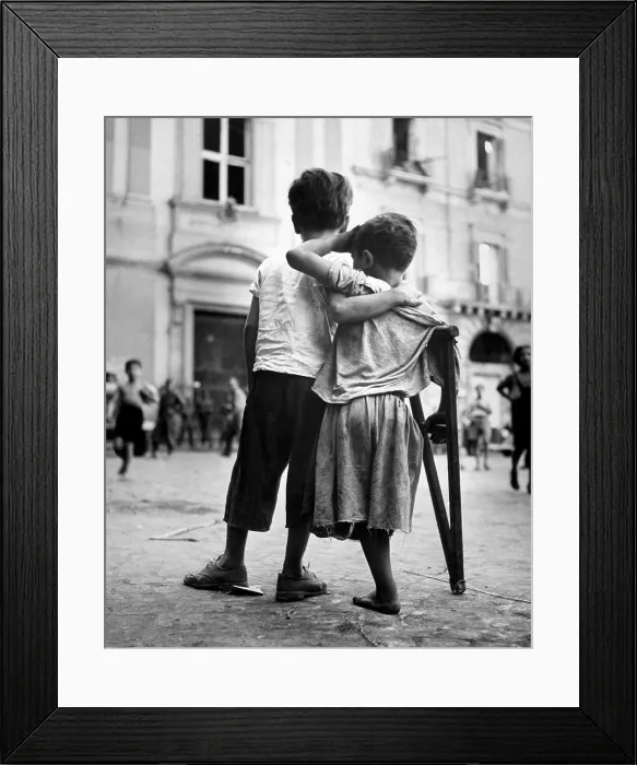 Framed Print : Little boy helps one-legged companion across street, August 1944. Naples, Italy, during World War 2. (BSLOC_2014_10_52)