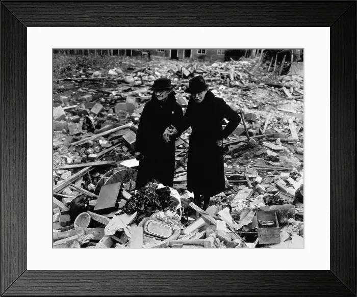 Framed Print : Two elderly women stand amid the ruins of the Almshouse that had been their home. The Germans bomber Newbury, Berkshire, England on Feb. 10, 1943. World War 2. (BSLOC_2014_10_59)