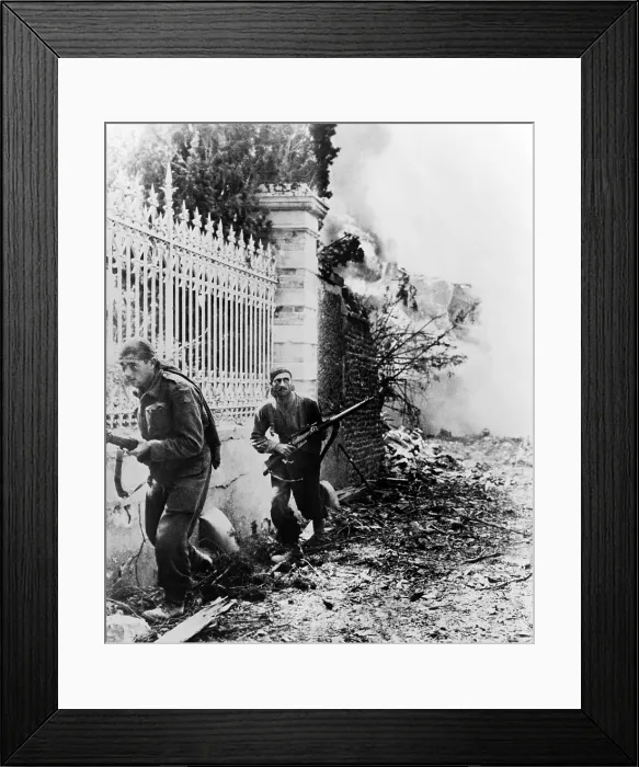 Framed Print : Two Canadian soldiers edge along wall, on the alert for German snipers, near Falaise, France. Ca. August 6-21, 1944. Normandy, World War 2. (BSLOC_2014_10_80)