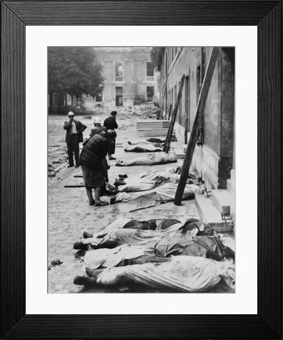 Framed Print : Friends and relatives look for their dead FFI (French Forces of the Interior) fighters. Their bodies are wrapped in sheets, lined up against building, possibly in Paris. Ca