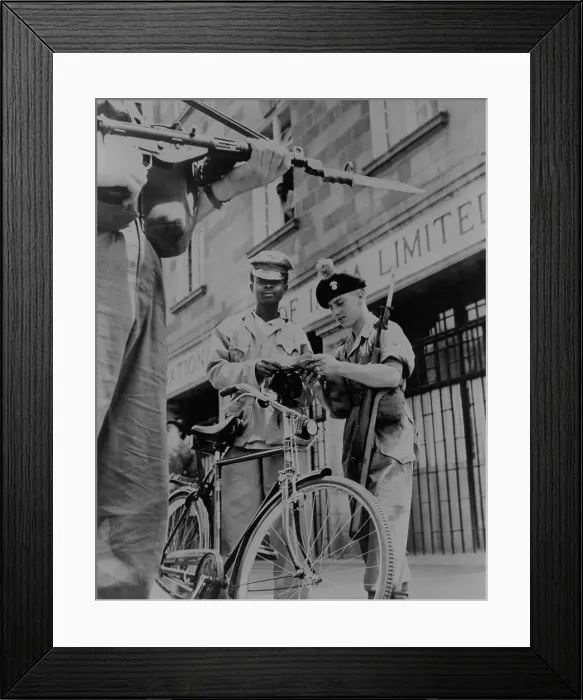 Framed Print : British soldiers examining papers of an African cyclist at gunpoint, in Nairobi, Kenya, 1953 Framed Print : British soldiers examining papers of an African cyclist at gunpoint, in Nairobi, Kenya, 1953