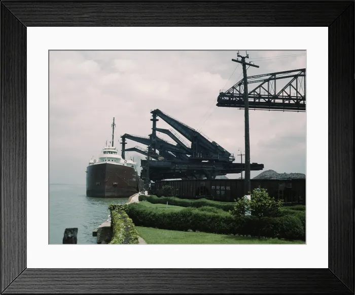 Framed Print : Great Lakes freighter unloading iron ore at the Pennsylvania Railroad ore docks in Cleveland Ohio