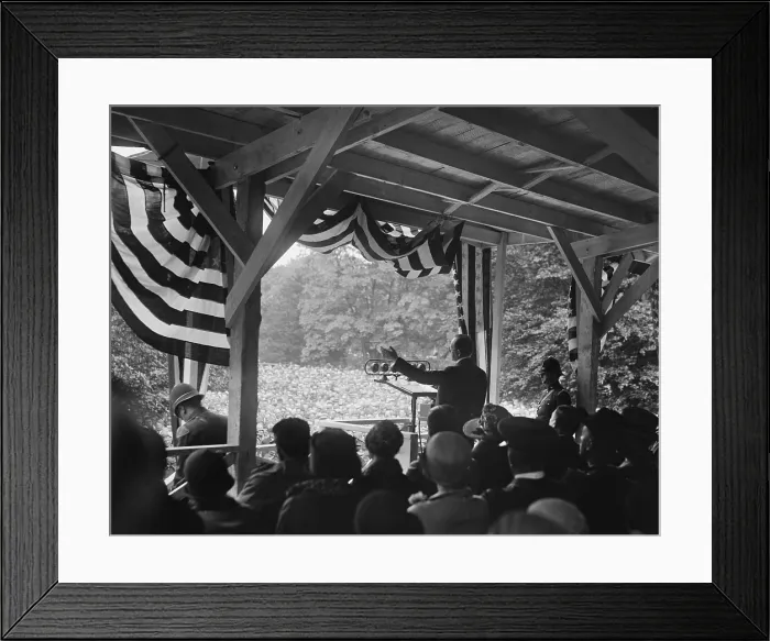 Framed Print : President Calvin Coolidge speaking to an outdoors crowd. He speaks from a bunting decorated enclosure with microphones in 1928. (BSLOC_2015_15_148) Framed Print : President Calvin Coolidge speaking to an outdoors crowd. He speaks from a bunting decorated enclosure with microphones in 1928. (BSLOC_2015_15_148)