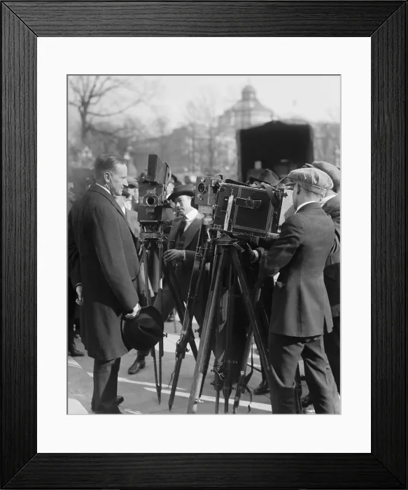 Framed Print : President Calvin Coolidge stands in front of newsreel cameras. 1921 in Washington, D.C. (BSLOC_2015_15_149)
