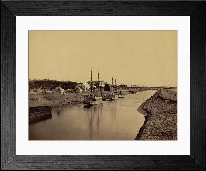 Framed Print : Small boats moored at water's edge to the Suez Canal at Ismailia. The Ismailia segment of the modern canal was completed in November 1862. 1860 photo by Francis Frith