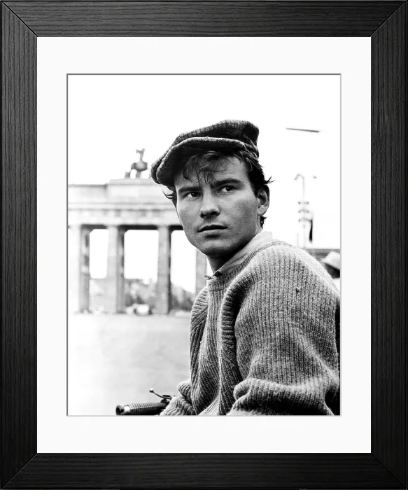 Framed Print : ONE, TWO, THREE, Horst Buchholz, on location in Berlin, in front of the Brandenburg Gate, 1961