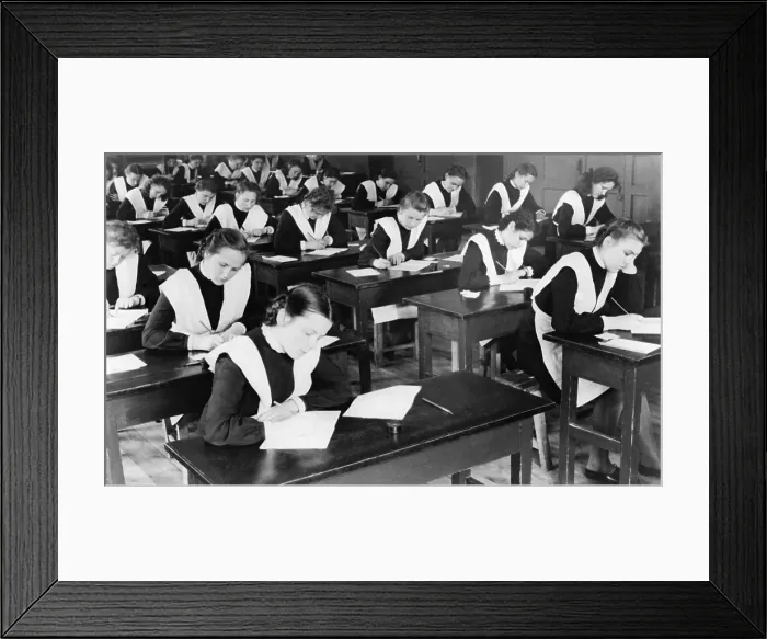 Framed Print : Soviet female graduates from the tenth grade writing compositions for their diplomas. Yaroslavl, USSR. 1948. - (BSLOC_2014_15_251)