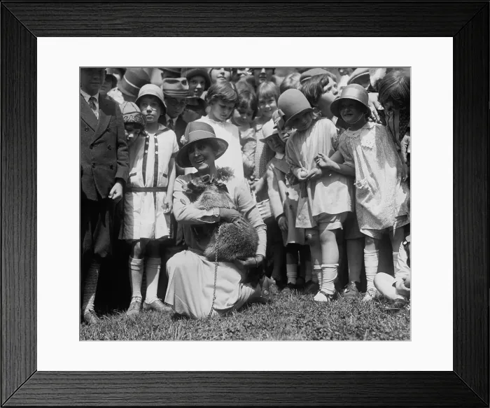 Framed Print : First Lady Grace Coolidge with her pet raccoon, Rebecca, at the White House Easter Egg Roll. April 18, 1927. (BSLOC_2015_15_172) Framed Print : First Lady Grace Coolidge with her pet raccoon, Rebecca, at the White House Easter Egg Roll. April 18, 1927. (BSLOC_2015_15_172)