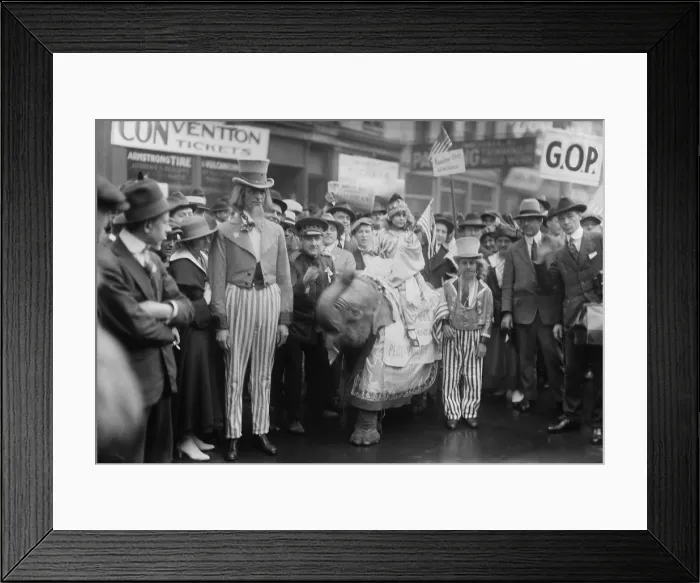 Framed Print : Chicago street scene during the 1916 Republican Convention. A man and boy are dressed as Uncle Sam, and a girl rides a baby elephant named Chin-Chin. (BSLOC_2015_15_198) Framed Print : Chicago street scene during the 1916 Republican Convention. A man and boy are dressed as Uncle Sam, and a girl rides a baby elephant named Chin-Chin. (BSLOC_2015_15_198)