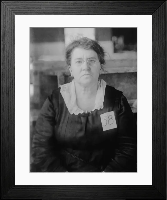Framed Print : Emma Goldman, wearing 38 tag while government custody, ca. 1917-20