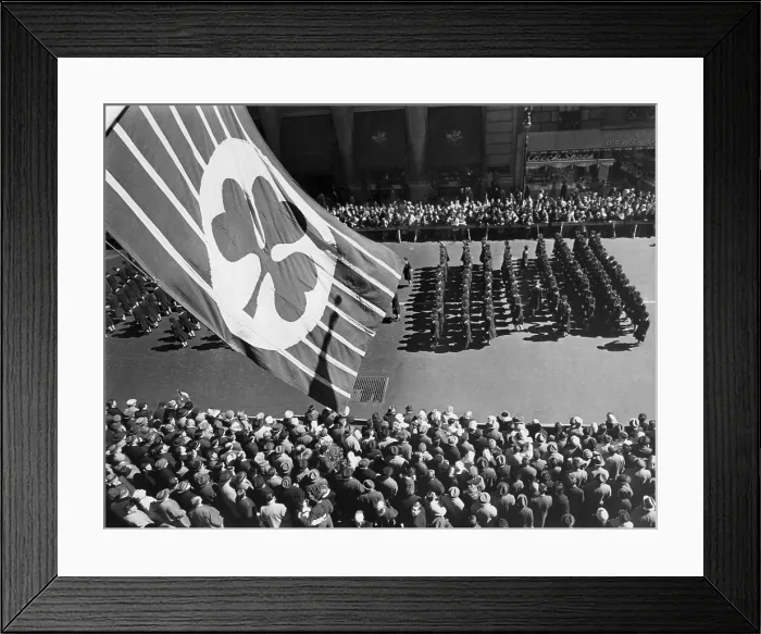 Framed Print : Flag with shamrock flies above Fifth Avenue as Saint Patrick's Day Parade passes below, New York City in 1961