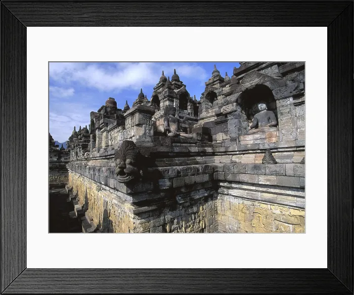 Framed Print : Borobudur Temple. 9th c. INDONESIA. CENTRAL JAVA. Borobudur. Temple walls decorated with friezes, statues and gargoyles (makara). Eastern Art. Sculpture; Architecture