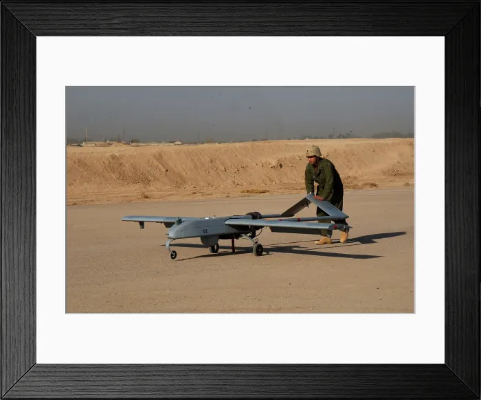 Framed Print : US Army soldier with an intelligence battalion recovers an Unmanned Aerial Vehicle following a mission over the Baqubah Iraq area. Sept. 22 2004. (BSLOC_2011_12_298) Framed Print : US Army soldier with an intelligence battalion recovers an Unmanned Aerial Vehicle following a mission over the Baqubah Iraq area. Sept. 22 2004. (BSLOC_2011_12_298)
