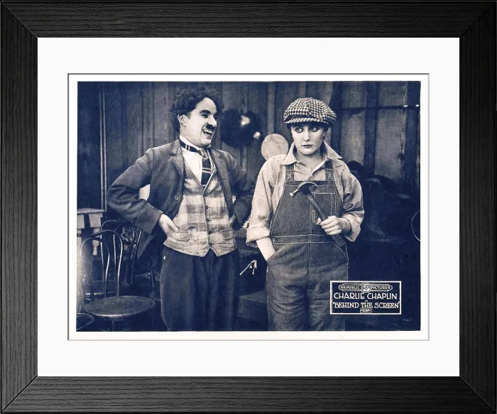 Framed Print : BEHIND THE SCREEN, (aka THE PRIDE OF HOLLYWOOD'), from left: Charles Chaplin (aka Charlie Chaplin'), Edna Purviance on a lobbycard, 1916