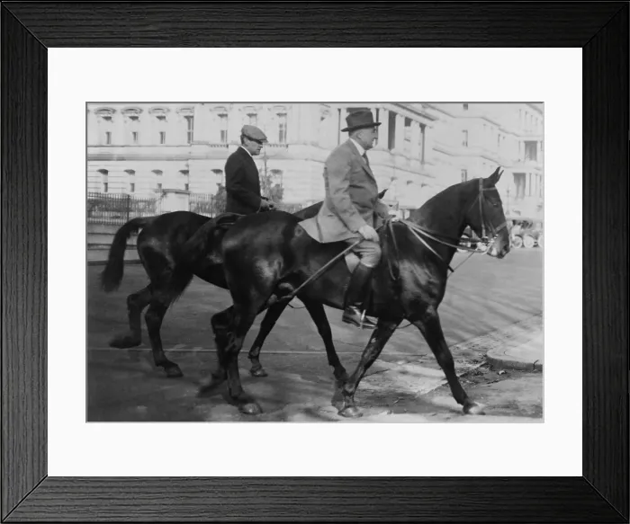 Framed Print : President Warren Harding and George Christian, Secretary to Harding, on horseback. They are riding on the National Mall