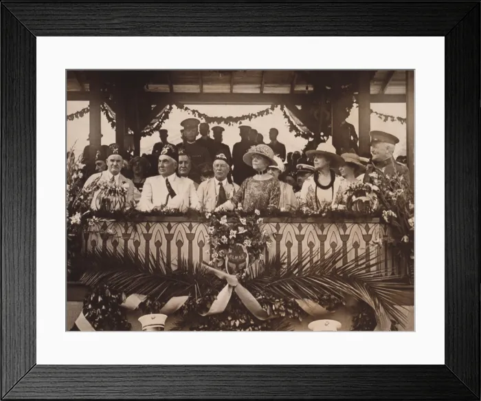 Framed Print : President Warren and Florence Harding watch the parade of Shrine Temple units pass the White House. With them is Imperial Potentate James B. McCandless of Aloha Temple and Mrs