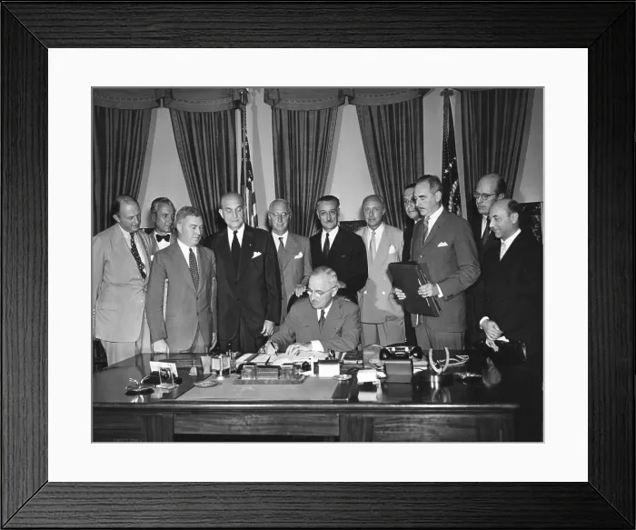 Framed Print : President Harry Truman signs the North Atlantic Pact on Aug. 24, 1949. Around him diplomats of signatory nations and American officials to witness this signing