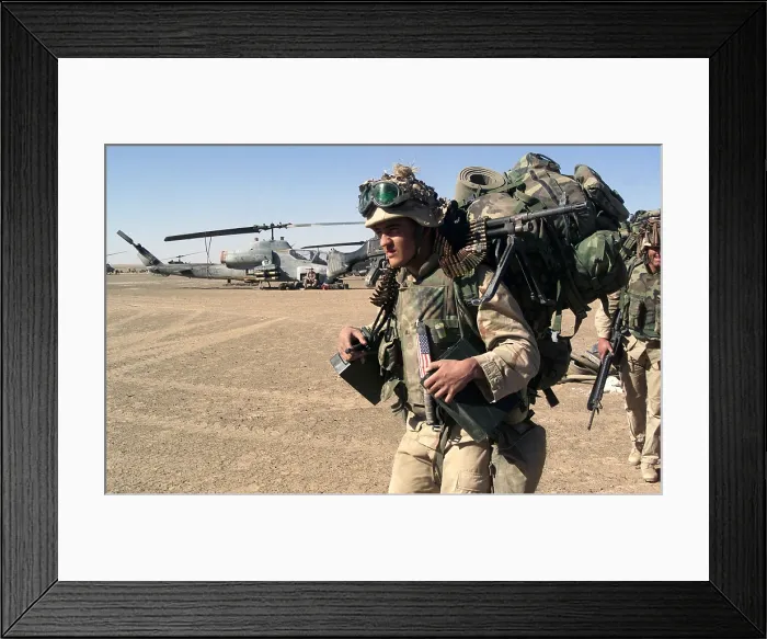 Framed Print : Infantryman carries a full combat load including a machine gun after seizing a forward operating base during the U.S Framed Print : Infantryman carries a full combat load including a machine gun after seizing a forward operating base during the U.S