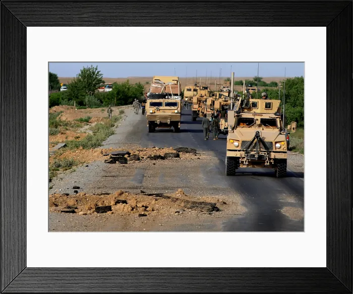 Framed Print : Improvised explosive device blast holes created a few hours before this U.S. Army convoy's passing in Southern Afghanistan Framed Print : Improvised explosive device blast holes created a few hours before this U.S. Army convoy's passing in Southern Afghanistan