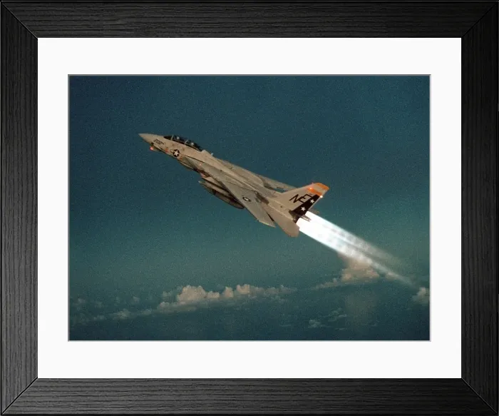 Framed Print : F-14 Tomcat Fighter climbs with its afterburners ignited during a take-off of the aircraft carrier USS RANGER. May 1 1989. (BSLOC_2011_12_216)