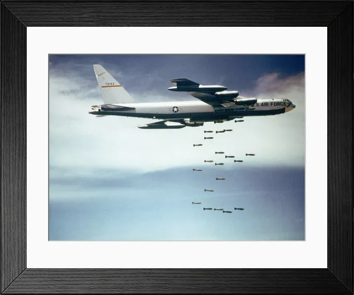 Framed Print : US Air Force B-52 dropping 750 pound bombs over Vietnam. Ca. 1965-1966. (BSLOC_2011_12_218)