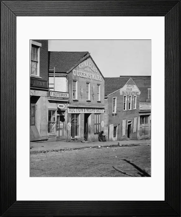 Framed Print : Atlanta, Georgia, slave auction house during Union General Sherman's occupation in September-October 1864. A Union soldier sits in front of the building. Photo by George N