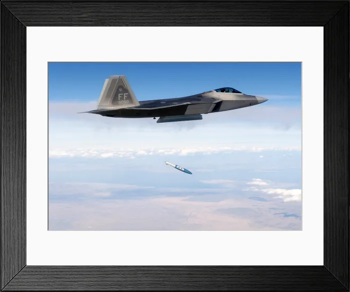 Framed Print : F-22 Raptor releases a 1 000-pound over the Utah Test and Training Range during weapons evaluation. October 20 2005. (BSLOC_2011_12_219)