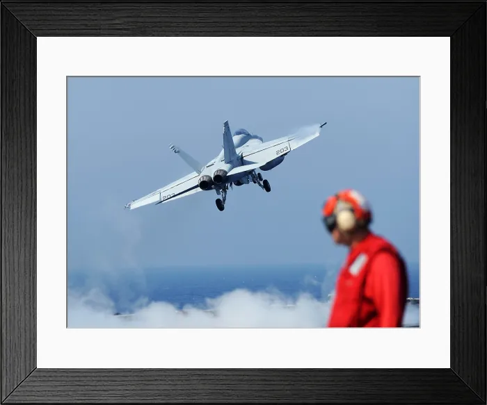 Framed Print : US Navy F-18 Hornet aircraft launches from the aircraft carrier USS Abraham Lincoln in the Gulf of Oman. Oct. 20 2010. (BSLOC_2011_12_227)