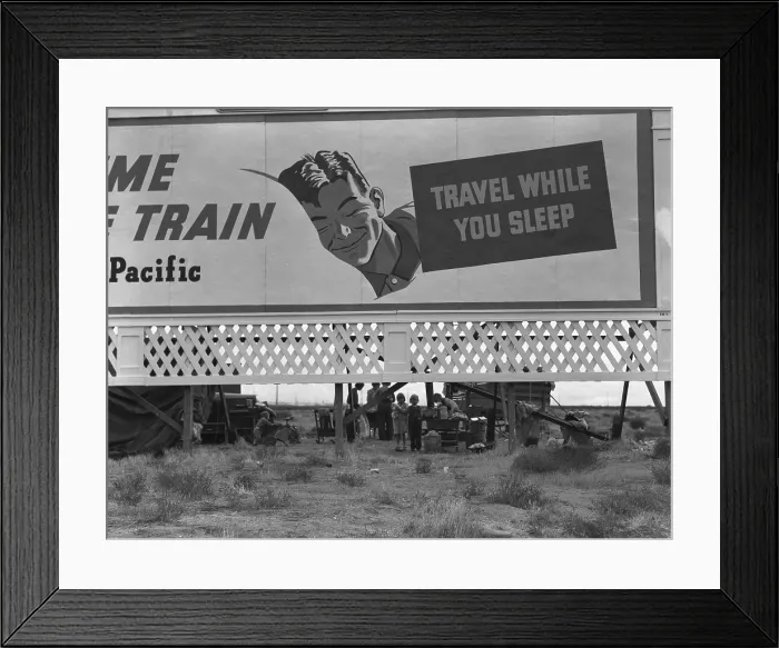 Framed Print : National Association of Manufacturers optimistic billboard on U.S. 99 shelters three homeless and destitute families of migrant laborers. Kern County, California