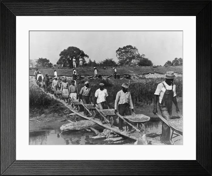 Framed Print : Fifteen African American laborers with wheel barrels hauling dirt to build a levee in Louisiana in 1935 as four whites supervise and watch the workers. 1935 photo by Ben Shahn Framed Print : Fifteen African American laborers with wheel barrels hauling dirt to build a levee in Louisiana in 1935 as four whites supervise and watch the workers. 1935 photo by Ben Shahn