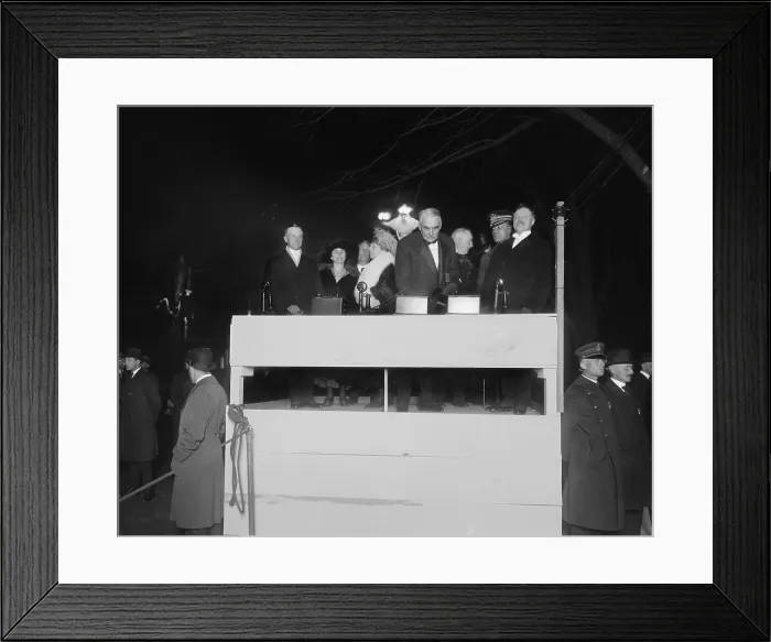 Framed Print : President Warren Harding pressing a ceremonial electric button. With him on the simple wooden podium is First Lady Florence Harding, Vice President Calvin and Grace Coolidge. Ca