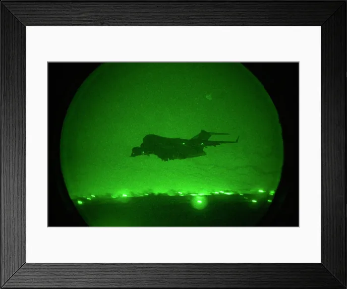 Framed Print : Seen in the green glow of a night scope a C-17 Globemaster military transport takes-off with lights out from an air base in Uzbekistan or Afghanistan after delivering its cargo