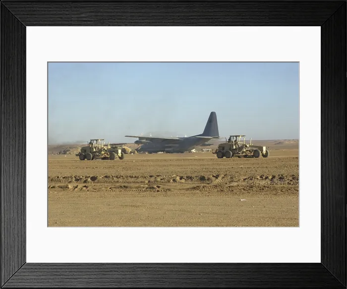 Framed Print : U.S. Navy Seabees run heavy graders down the runway to patch holes and remove excess dirt in the first weeks occupation of Kandahar on Dec. 18 2001