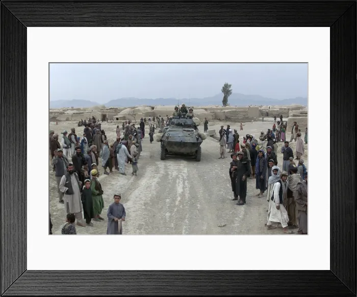 Framed Print : Afghans mostly men and boys greet Marines on patrol in a village near Kandahar. U.S. and coalition forces entered the Kandahar region a month earlier in late Nov Framed Print : Afghans mostly men and boys greet Marines on patrol in a village near Kandahar. U.S. and coalition forces entered the Kandahar region a month earlier in late Nov
