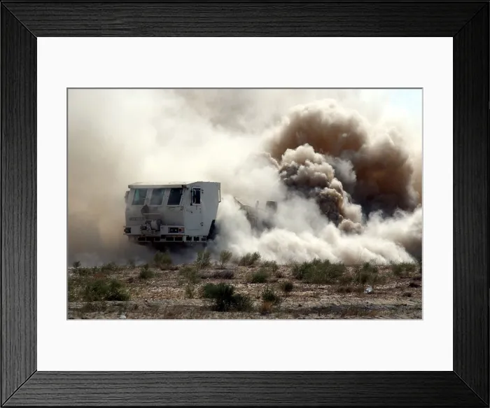 Framed Print : U.S. soldiers employ a mine clearing vehicle near the Bagram Air Base Afghanistan