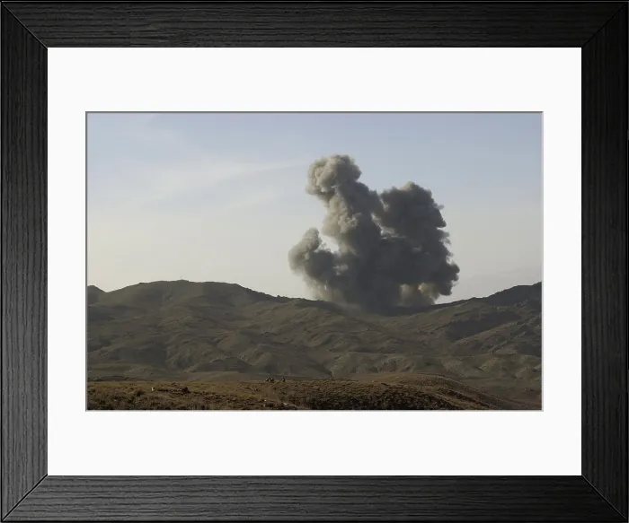 Framed Print : An enemy position in Afghanistan's Gardez Valley is destroyed by smart bombs dropped by B-52 bombers attacking al-Qaeda and Taliban forces. Mar