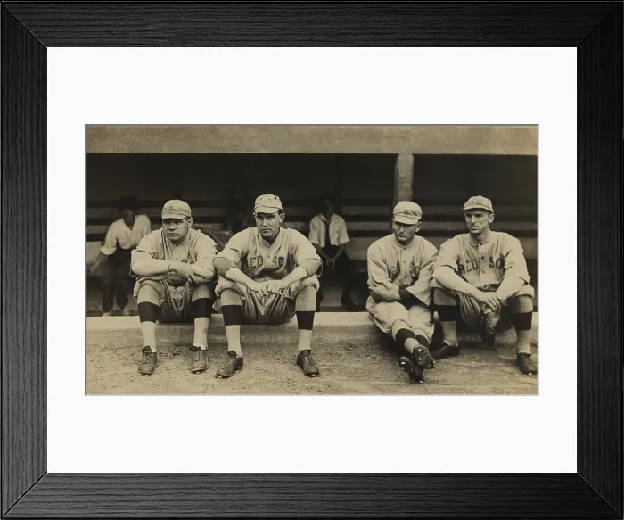 Framed Print : Boston Red Sox players sitting in front of their dugout