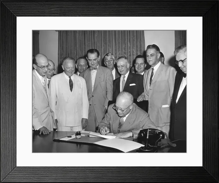 Framed Print : President Eisenhower signs H.R. 1 in the Cabinet Room. June 21, 1955. The law extended the authority of the President to enter into trade agreements under the Tariff Act of 1930