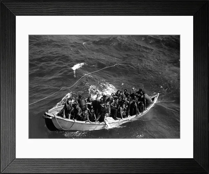 Framed Print : Survivors of USS Princeton in life boat as seen from USS Cassin Young. USS Princeton was sunk in the Battle of Leyte Gulf on Oct. 24, 1944