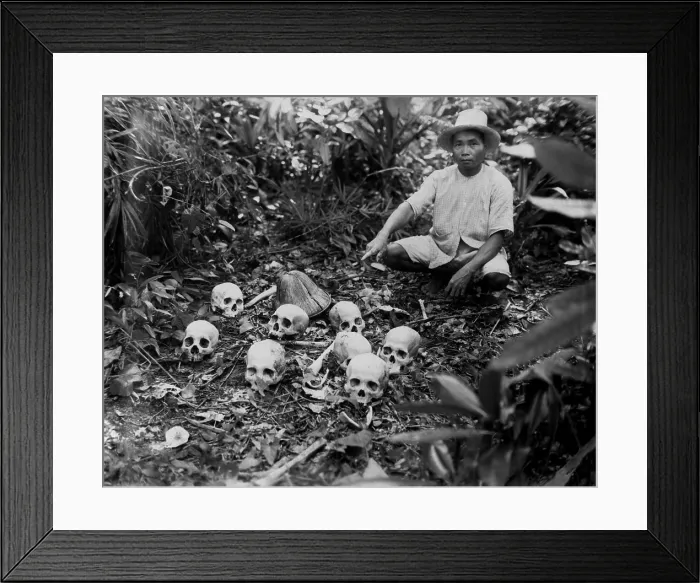 Framed Print : Evidence of the Tapel Massacre, of July 1, 1945. Pedro Cerono, discovered the group of 8 skulls. Tapel, Cagayan Province, Luzon, Philippine Islands. World War 2