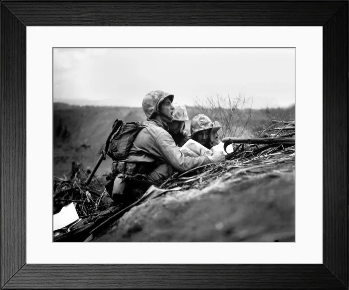 Framed Print : Marine observer finds the location of a machine gun nest on a map of Iwo Jima. With this information the artillery or mortars would target the position. Between Feb. 19-28, 1945