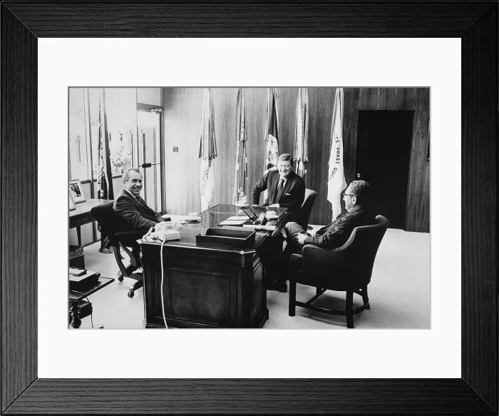 Framed Print : Richard Nixon and Henry Kissinger meeting with John Wayne