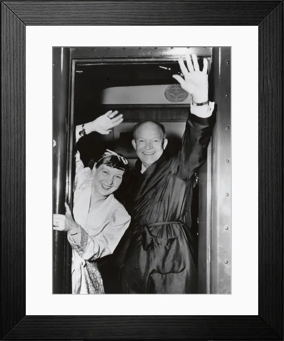 Framed Print : Republican Presidential candidate Dwight Eisenhower and Wife Mamie wave from their campaign train. July-Nov. 1952. They are wearing dressing gowns. - (BSLOC_2014_16_4) Framed Print : Republican Presidential candidate Dwight Eisenhower and Wife Mamie wave from their campaign train. July-Nov. 1952. They are wearing dressing gowns. - (BSLOC_2014_16_4)