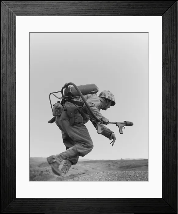Framed Print : Marine with a flame-thrower, running to assault a Japanese pillbox on Motoyama Airfield Number Two. Iwo Jima. Ca. Feb. 20-March 16, 1945. World War 2. (BSLOC_2013_13_74) Framed Print : Marine with a flame-thrower, running to assault a Japanese pillbox on Motoyama Airfield Number Two. Iwo Jima. Ca. Feb. 20-March 16, 1945. World War 2. (BSLOC_2013_13_74)