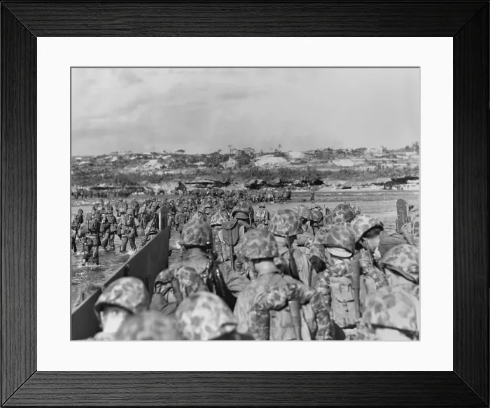 Framed Print : Marines leave their landing craft to wade over a coral reef to the Okinawa beach. The Japanese did not oppose the invasion, but waiting in fortified positions inland Framed Print : Marines leave their landing craft to wade over a coral reef to the Okinawa beach. The Japanese did not oppose the invasion, but waiting in fortified positions inland