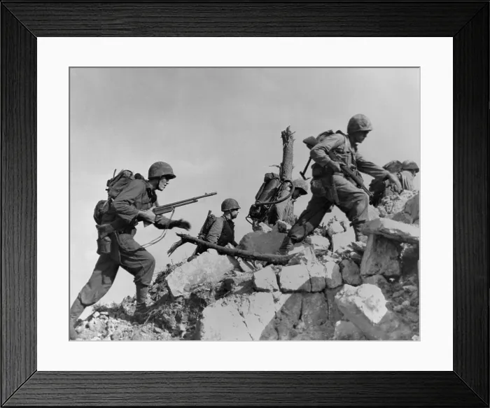 Framed Print : Marines hurdle a stone wall as they arrive in Okinawa, initally unopposed by Japanese defenders. April 1, 1945. World War 2. (BSLOC_2013_13_81) Framed Print : Marines hurdle a stone wall as they arrive in Okinawa, initally unopposed by Japanese defenders. April 1, 1945. World War 2. (BSLOC_2013_13_81)