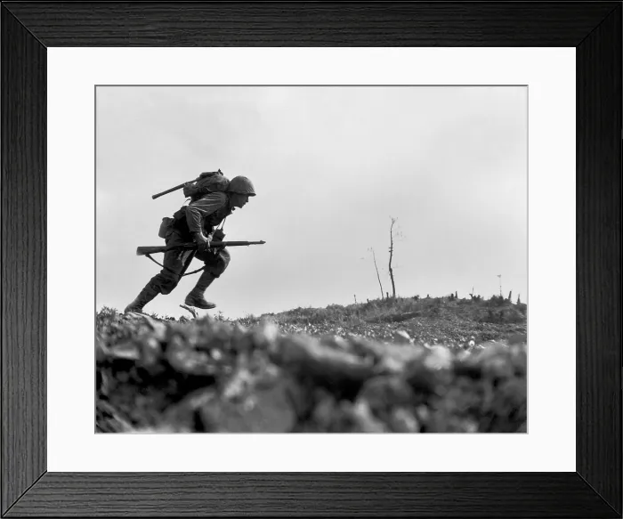 Framed Print : Marine Pfc. Paul E. Ison runs through Japanese machine gun fire on Okinawa, May 10, 1945
