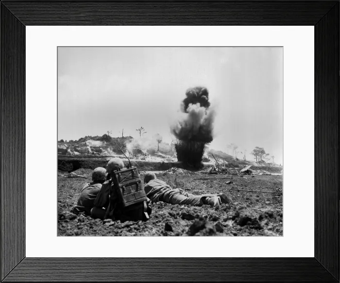 Framed Print : Marine demolition crew watch dynamite charges explode and destroy a Japanese cave. 6th Marine Division, May 1945. World War 2. (BSLOC_2013_13_93)