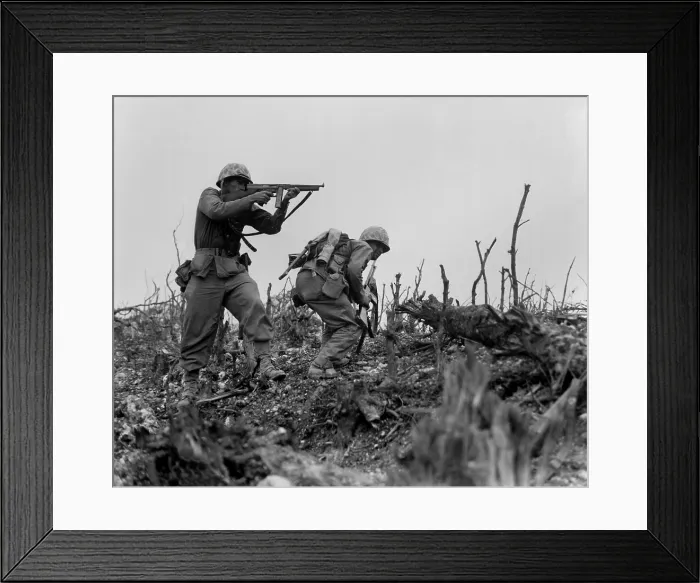 Framed Print : Marine sights his tommy gun on a Japanese sniper, as his companion ducks for cover. With the 1st Marines, they are engaged in taking Wana Ridge before the town of Shuri, Okinawa