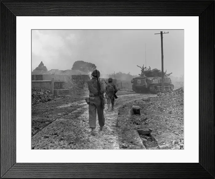 Framed Print : Sixth Division Marine tanks and riflemen entering Naha, capital city of Okinawa, May 1945. The city was in ruins after U.S. aerial bombing and artillery barrages. World War 2